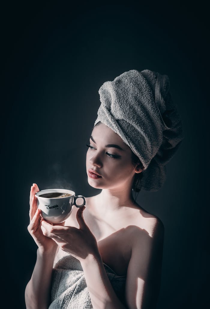 Sensual woman with mug of hot coffee